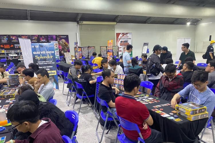 Road to Essen participants playtesting at long tables