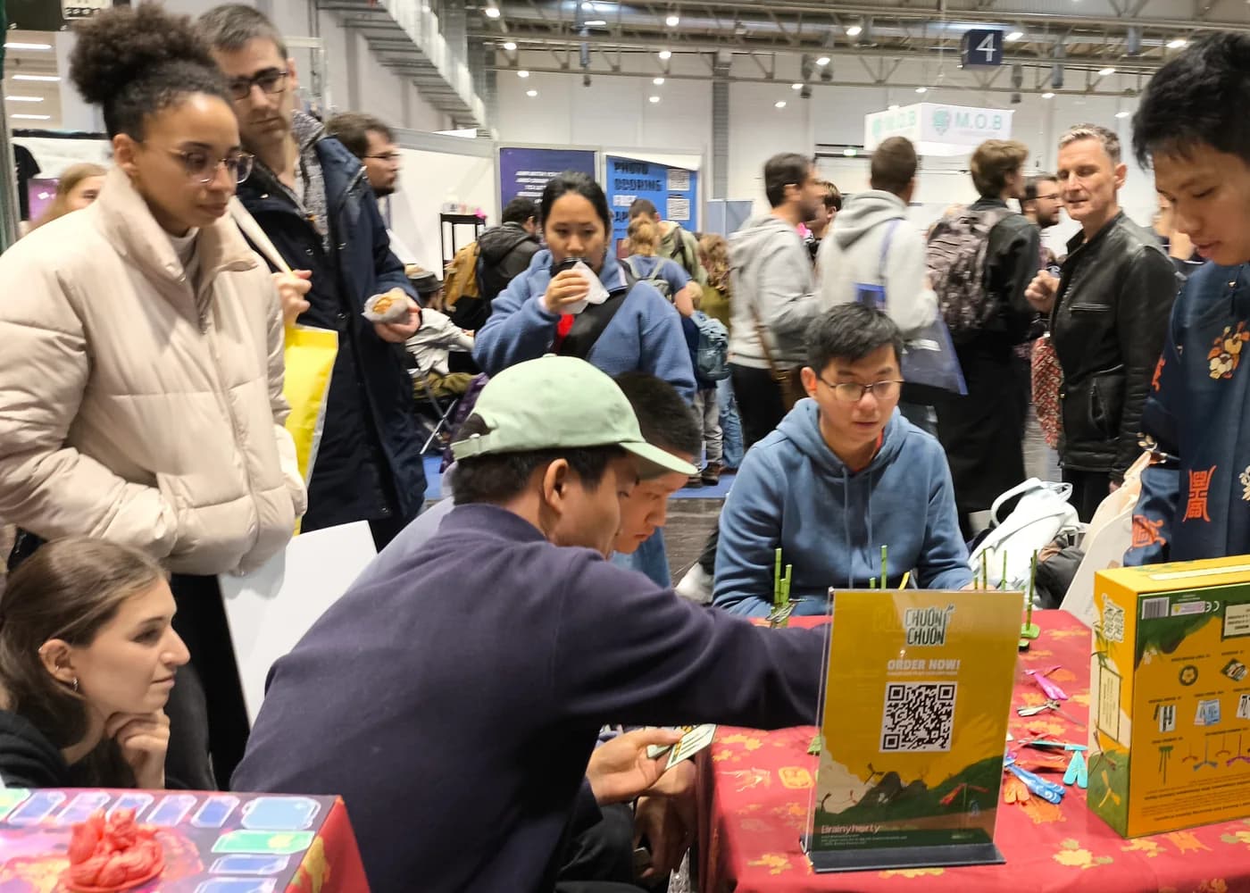 International visitors watching an Everjoy game demo at SPIEL Essen